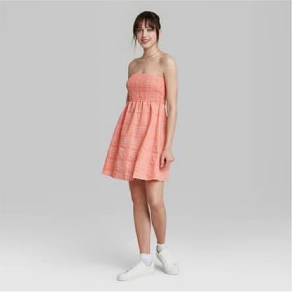 Smocked tube top babydoll dress in Coral